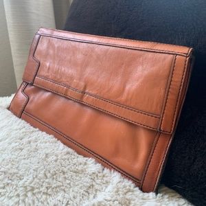 Orange leather clutch